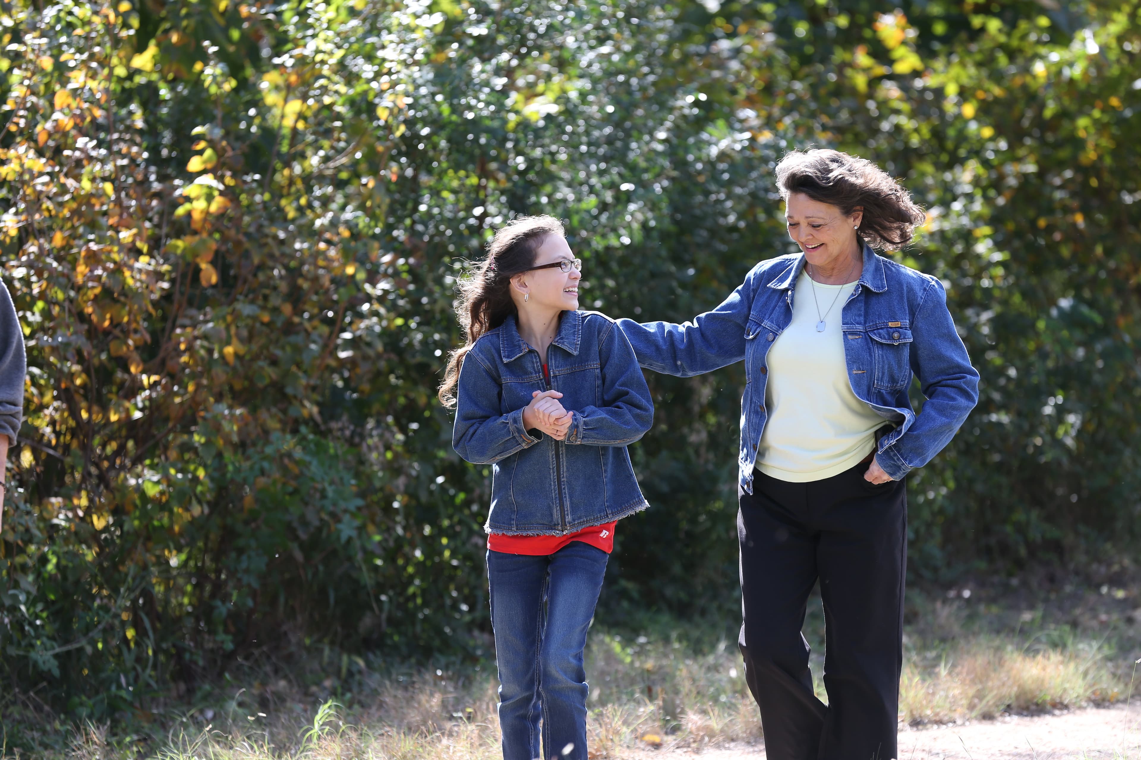 Diana Wagoner walking outdoors with family